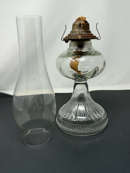 Vintage glass oil lamp front view with chimney