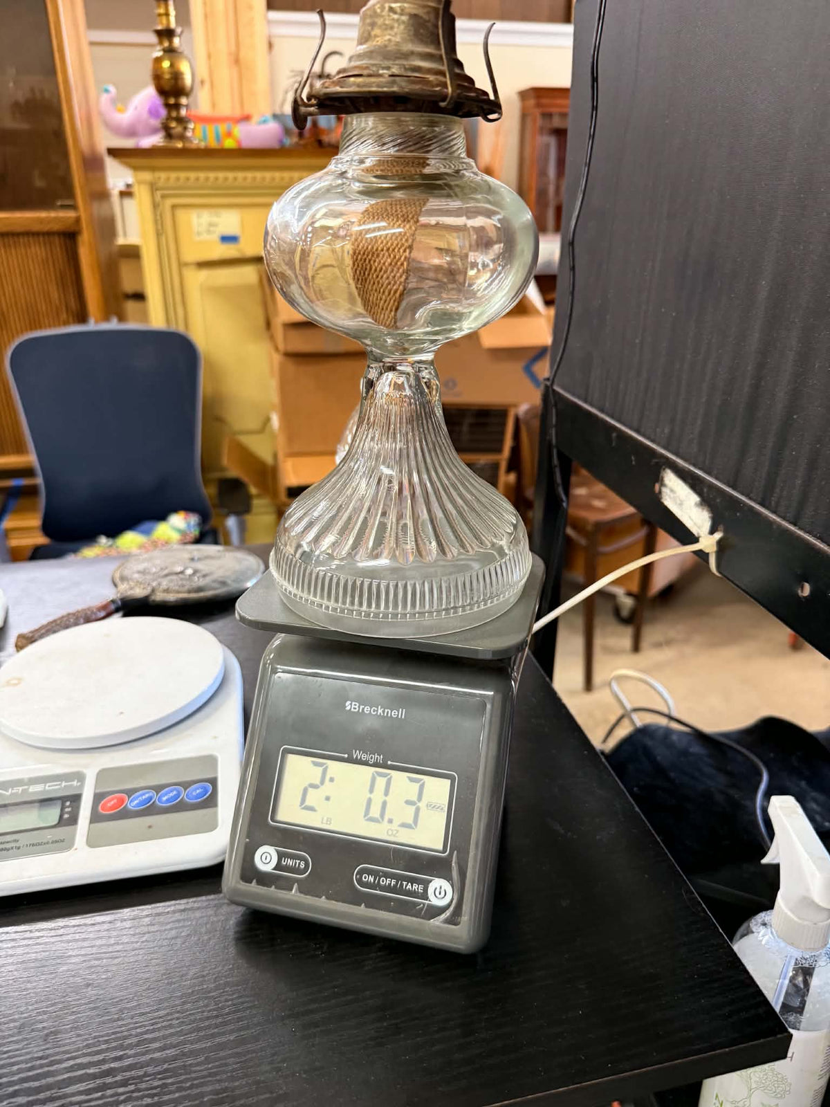 Vintage glass oil lamp on scale