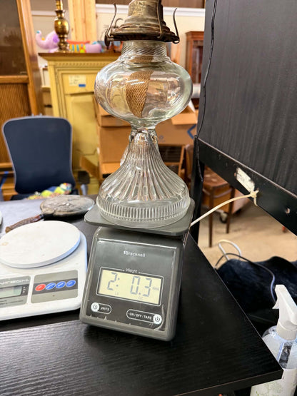 Vintage glass oil lamp on scale